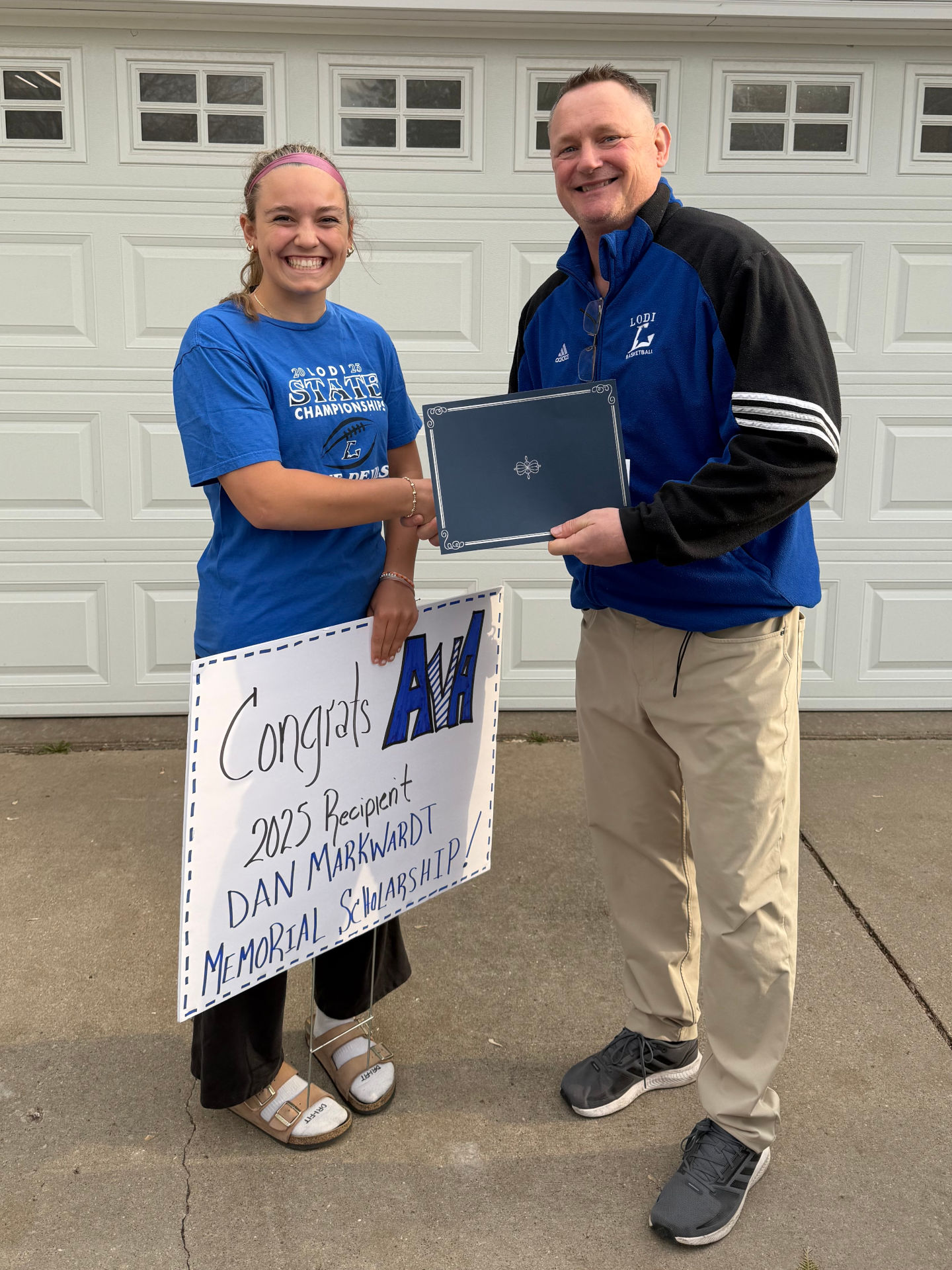 DMMF Board President, Mitch Hauser, presenting a 2025 scholarship to Ava