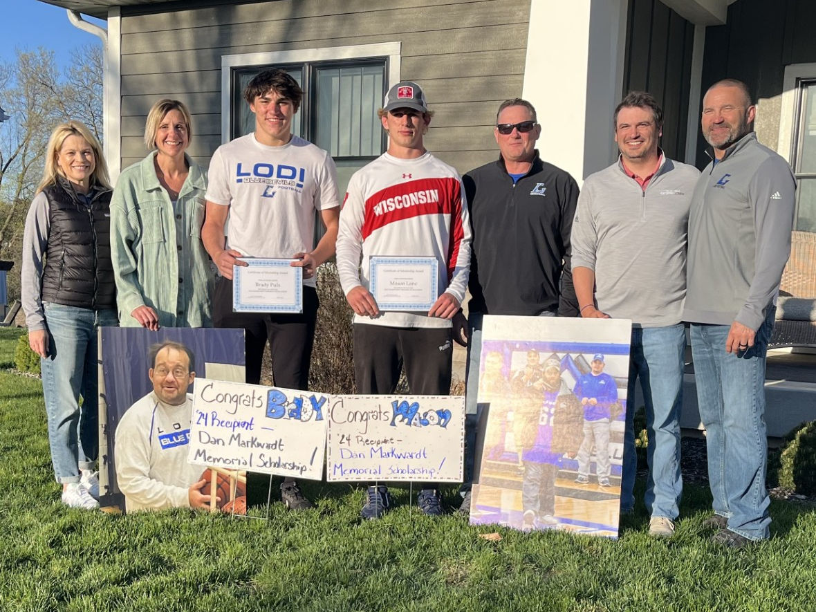 picture of Brady Puls and Mason Lane with the scholarship committee members