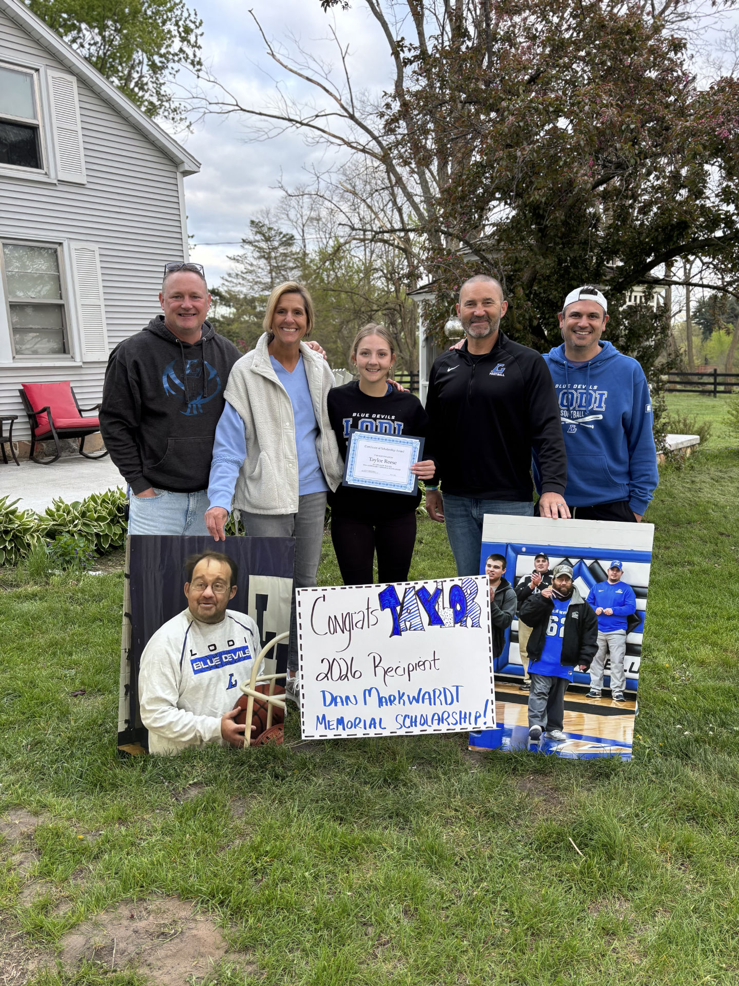 Taylor with members of the DMMF Board. Left to Right: Mitch Hauser, Michelle Puls, Taylor, Dave Puls, Geoff Lorenz.